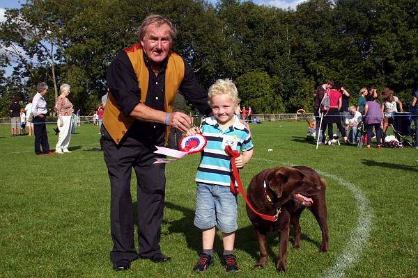 Millie, Dog of the Day with 5-year-old Thomas Evans and judge Malcolm Butler.jpg